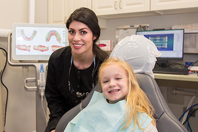 dental assistant poses with happy patient at Legacy Hill Dentistry in Smyrna, TN